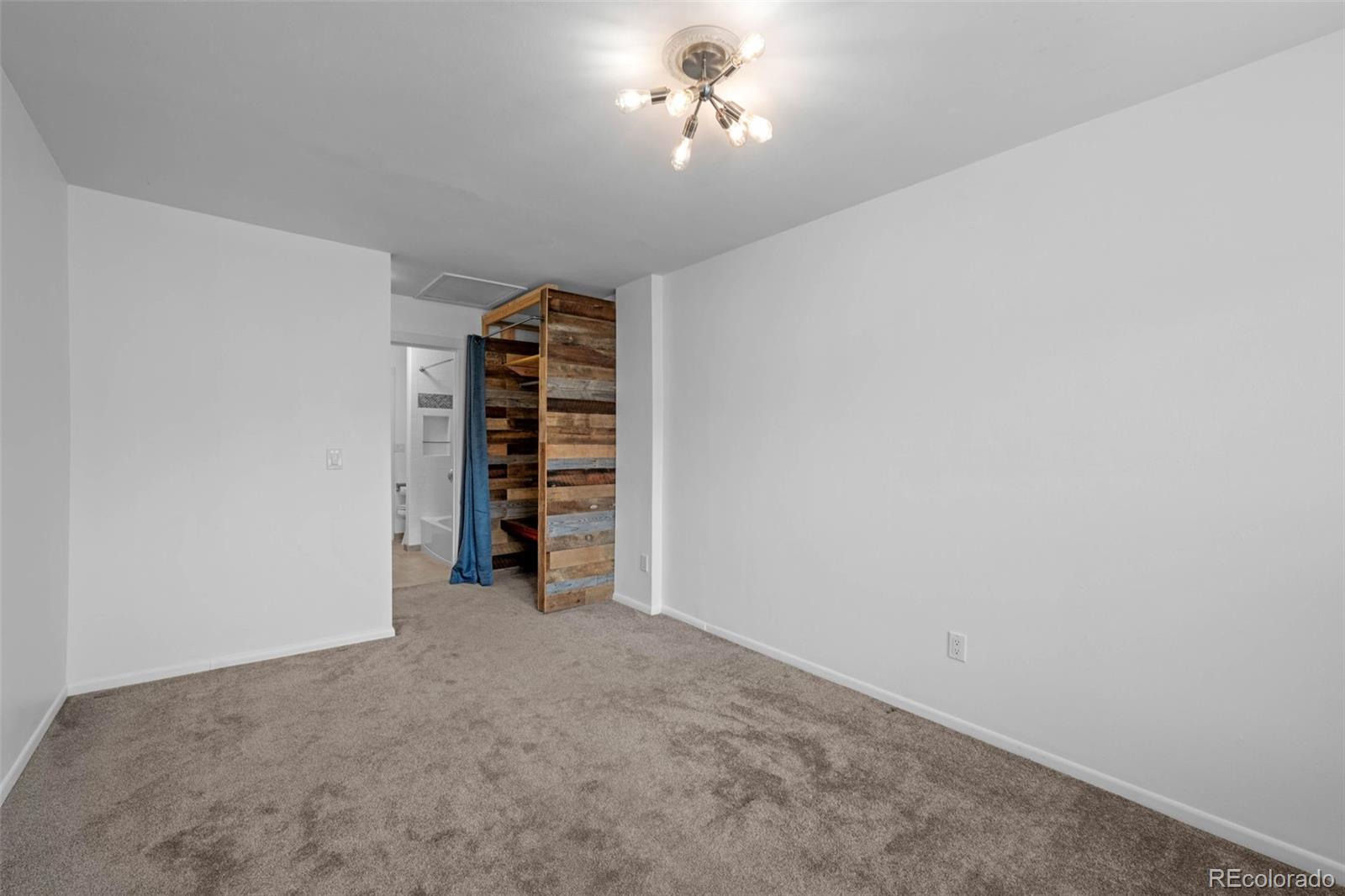 34 Benthaven Place Boulder, CO 80305 - Photo 29 of 40 a view of an empty room with a ceiling fan