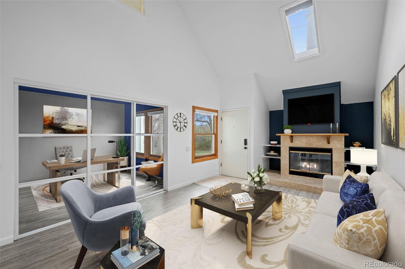 34 Benthaven Place Boulder, CO 80305 - Photo 3 of 40 a living room with furniture a flat screen tv and a fireplace