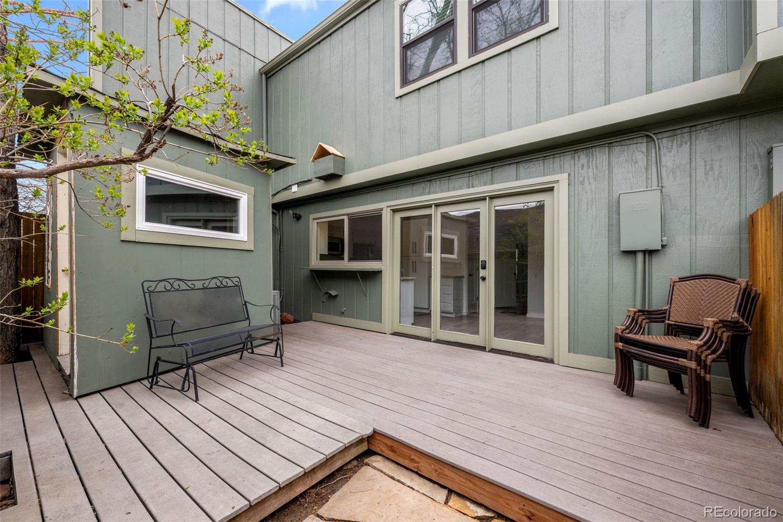 34 Benthaven Place Boulder, CO 80305 - Photo 34 of 40 a view of a deck with wooden floor and furniture