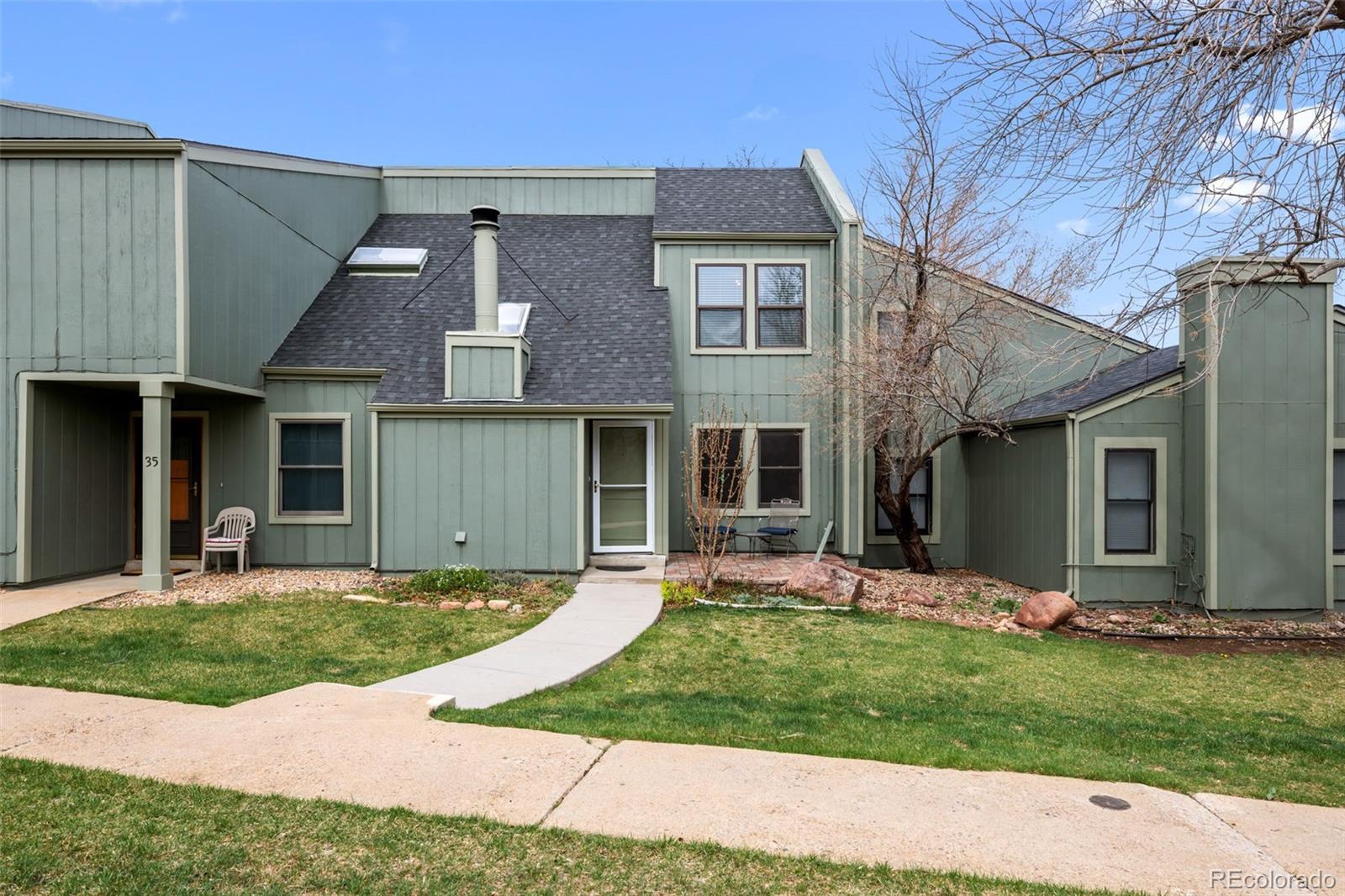 34 Benthaven Place Boulder, CO 80305 - Photo 37 of 40 a front view of a house with a garden and yard