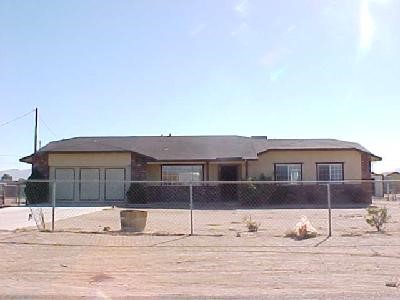 10533 Jamul Road Apple Valley, CA 92308 - Photo 1 of 1 a front view of a house with a yard