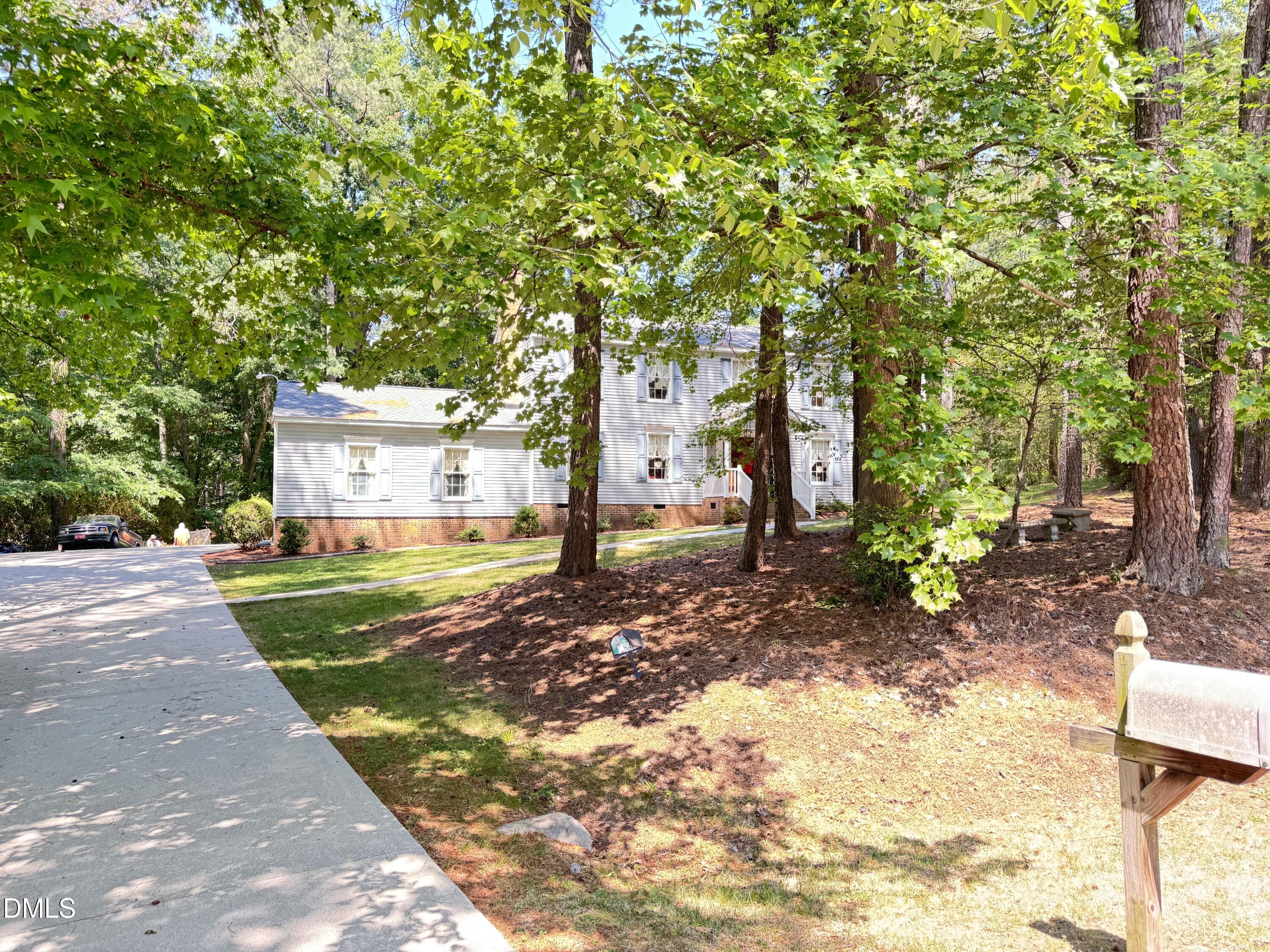 84 Wintergreen Road Henderson, NC 27537 - Photo 40 of 49 a view of a yard with plants and trees