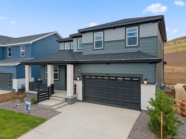 a front view of a house with garage