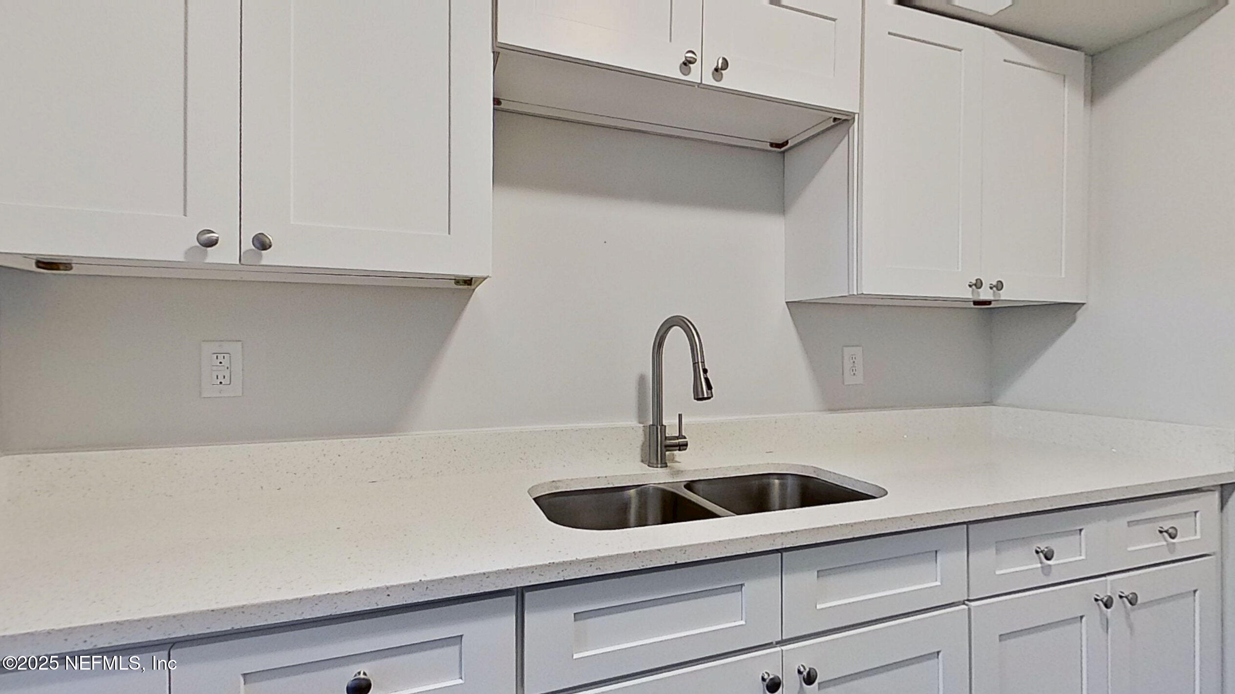 2216 Spring Park Road, Unit 6 Jacksonville, FL 32207 - Photo 12 of 32 a kitchen with white cabinets and a sink