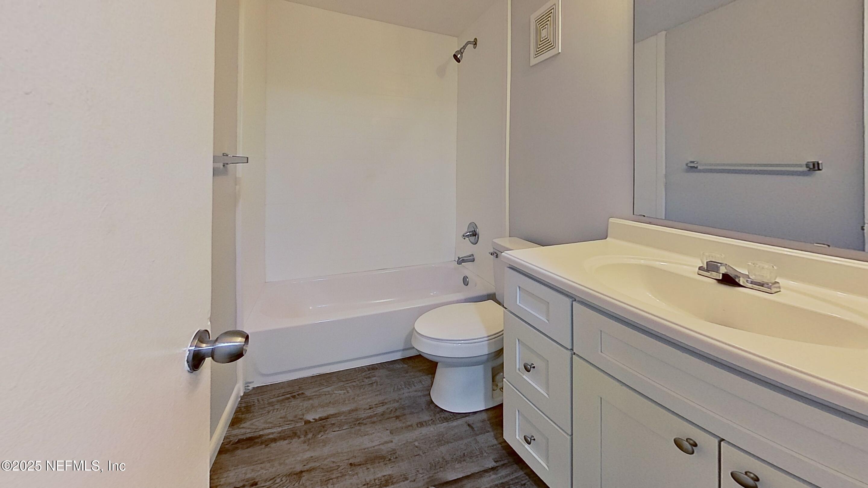 2216 Spring Park Road, Unit 6 Jacksonville, FL 32207 - Photo 26 of 32 a bathroom with a sink a toilet and shower