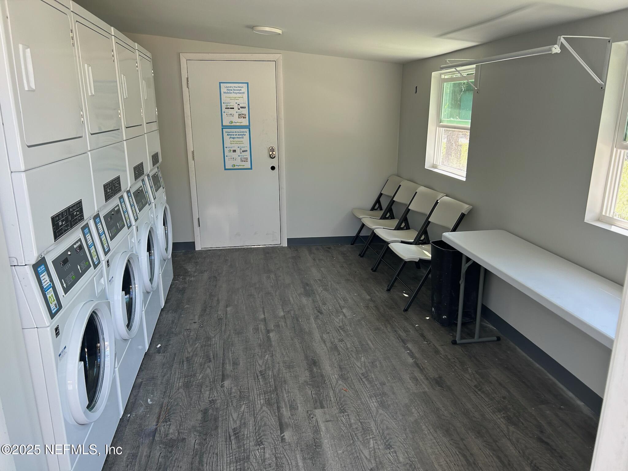2216 Spring Park Road, Unit 6 Jacksonville, FL 32207 - Photo 5 of 32 a living room with furniture and a wooden floor