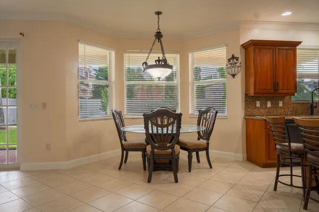 a dining room with furniture and window