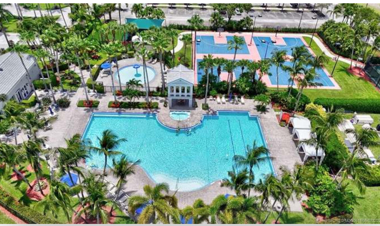 2261 Ridgewood Circle Royal Palm Beach, FL 33411 - Photo 9 of 12 an aerial view of a house with a garden and lake view