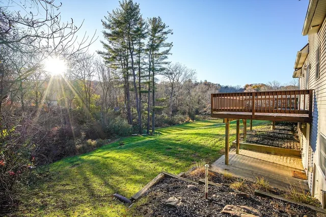 a view of a chair and tables in the garden