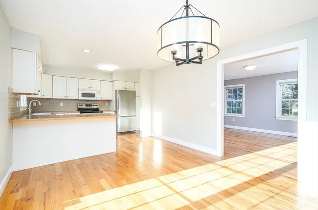 a view of kitchen center island and stainless steel appliances