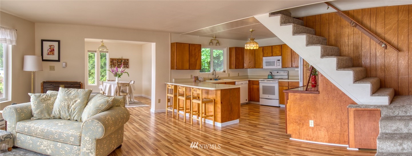 3370 East Quilcene Road Quilcene, WA 98376 - Photo 13 of 34 a living room with furniture and wooden floor