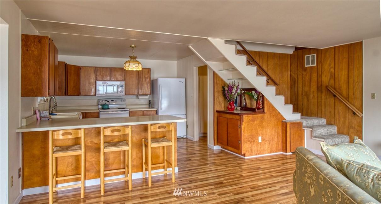 3370 East Quilcene Road Quilcene, WA 98376 - Photo 14 of 34 a view of a kitchen with furniture and staircase