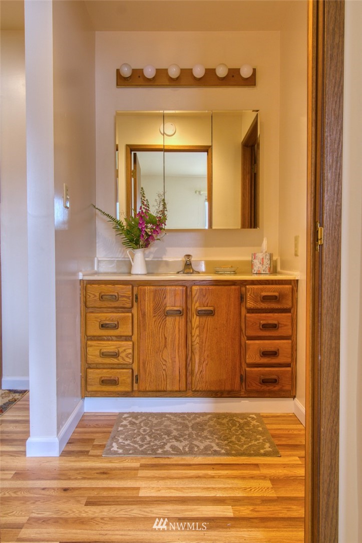 3370 East Quilcene Road Quilcene, WA 98376 - Photo 17 of 34 a bathroom with a sink and a mirror