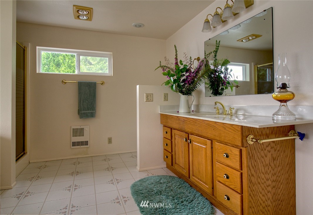 3370 East Quilcene Road Quilcene, WA 98376 - Photo 21 of 34 a bathroom with a sink and a mirror