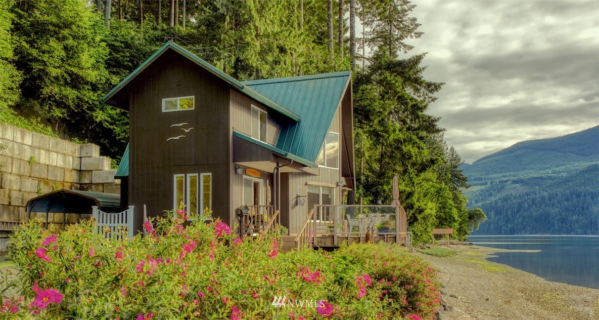 3370 East Quilcene Road Quilcene, WA 98376 - Photo 30 of 34 a view of a house with a yard and garden