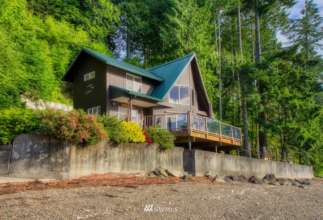 3370 East Quilcene Road Quilcene, WA 98376 - Photo 4 of 34 a view of a house with a yard