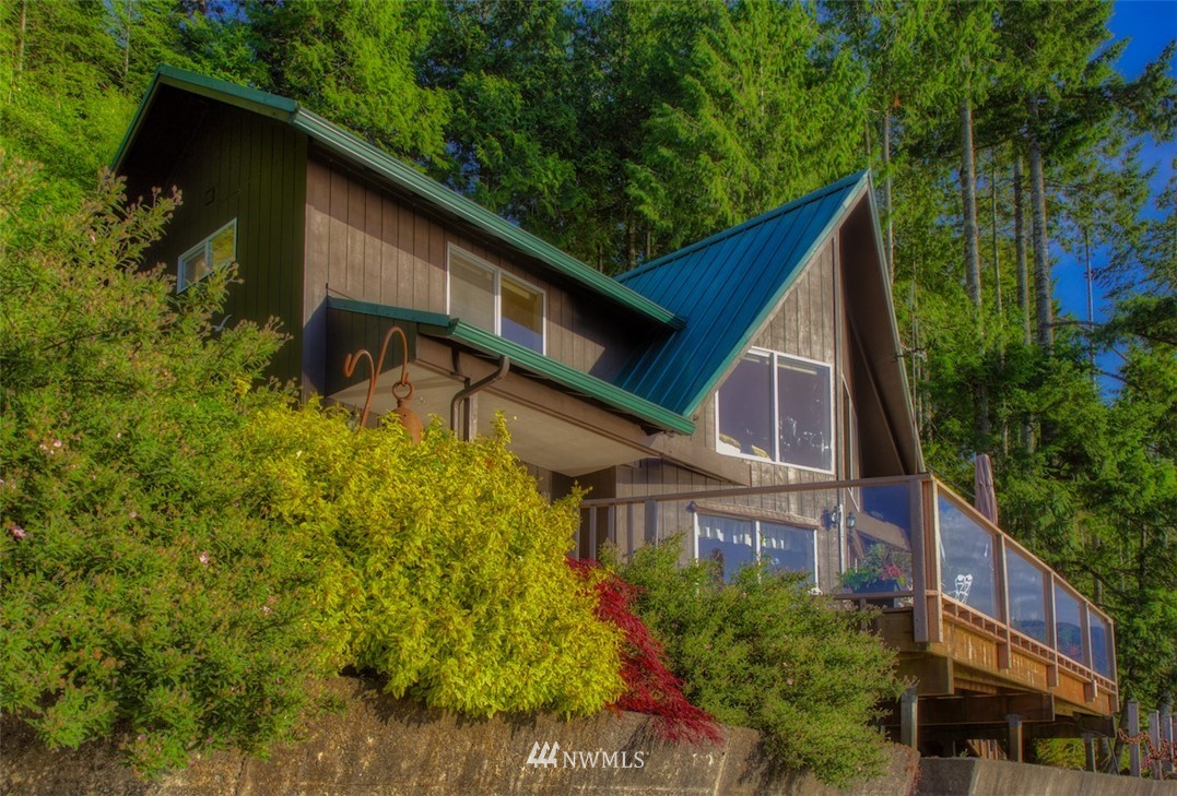 3370 East Quilcene Road Quilcene, WA 98376 - Photo 32 of 34 a view of a house with a yard