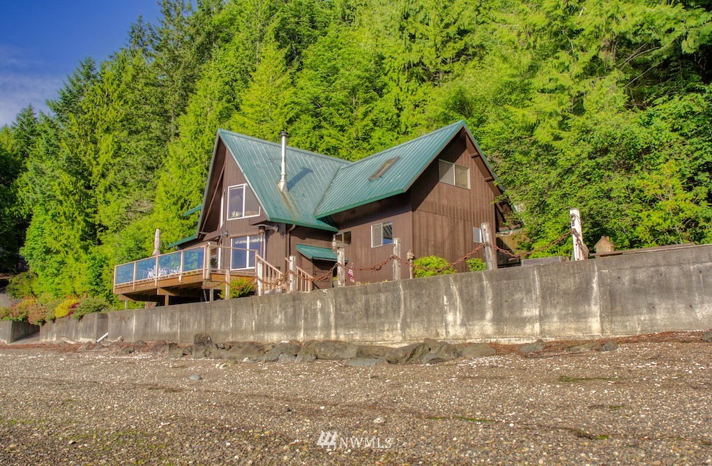3370 East Quilcene Road Quilcene, WA 98376 - Photo 5 of 34 a view of a house with a yard