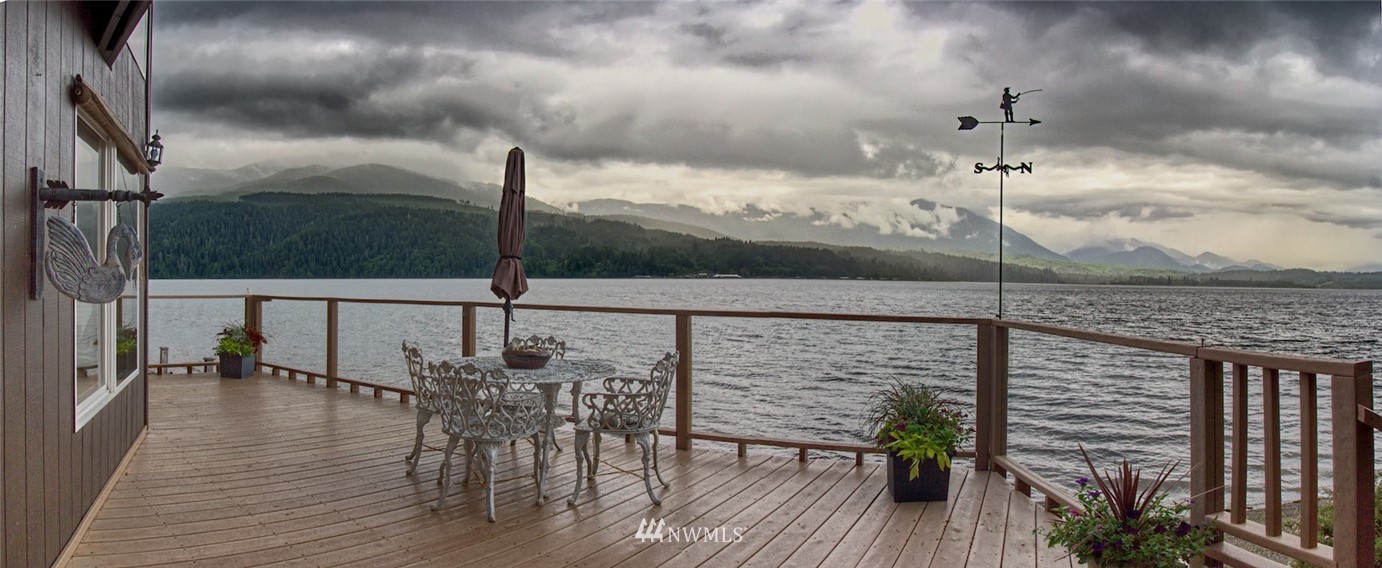 3370 East Quilcene Road Quilcene, WA 98376 - Photo 7 of 34 a roof deck with table and chairs