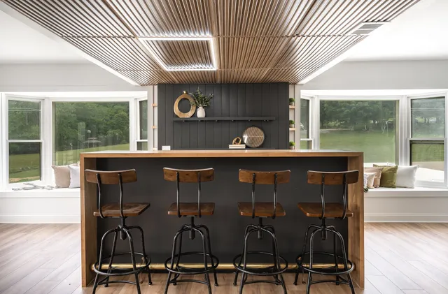 a dining room with furniture and wooden floor