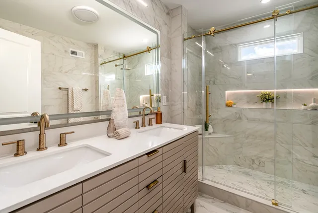 a bathroom with a granite countertop sink mirror and double