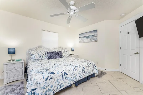 a view of a dining room and livingroom with furniture wooden floor a chandelier