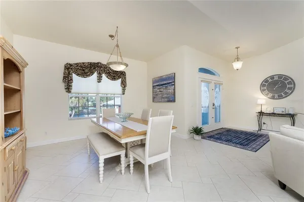 a dining room with furniture and window