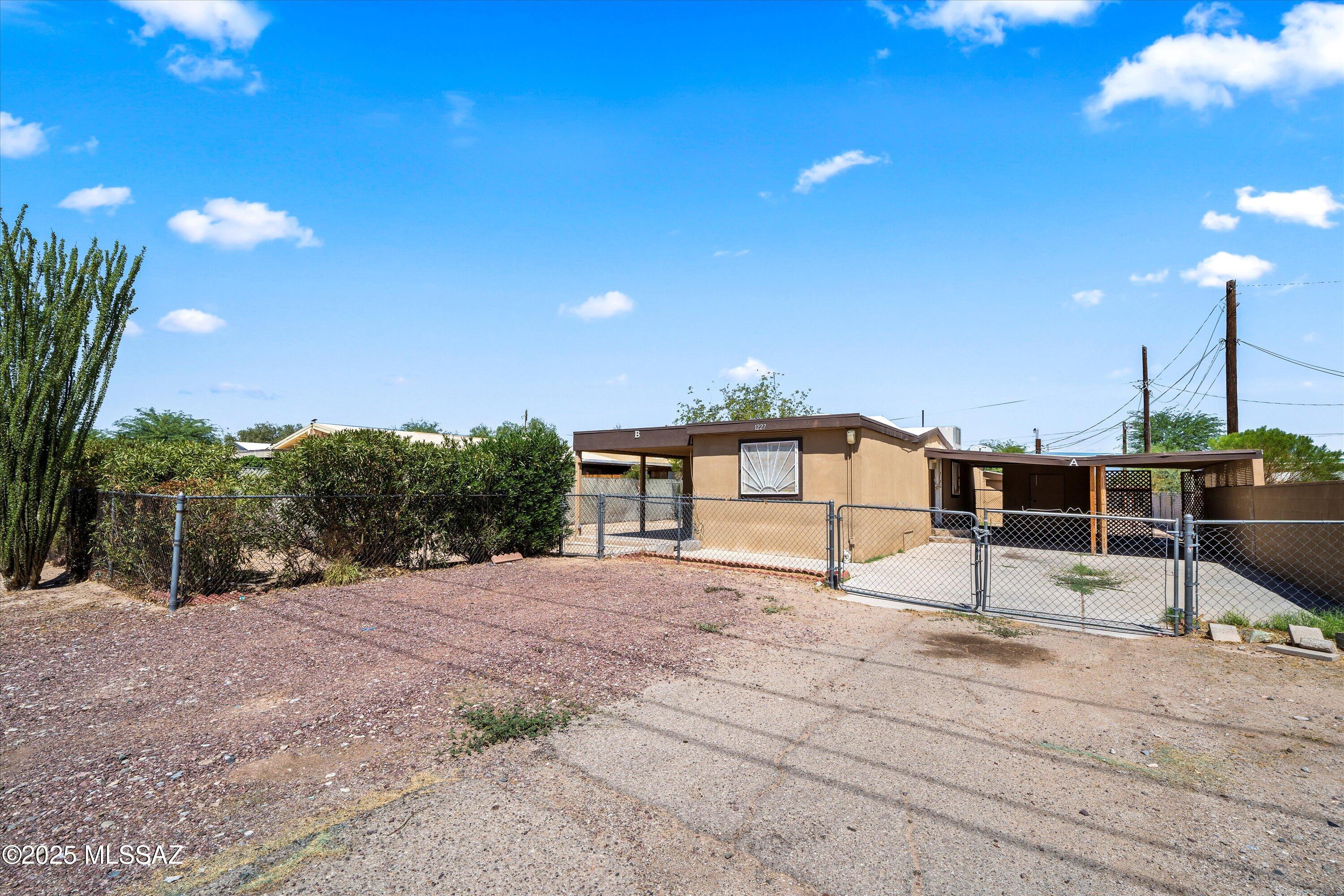 1227 East Ginter Road Tucson, AZ 85706 - Photo 1 of 18 a house with a outdoor space