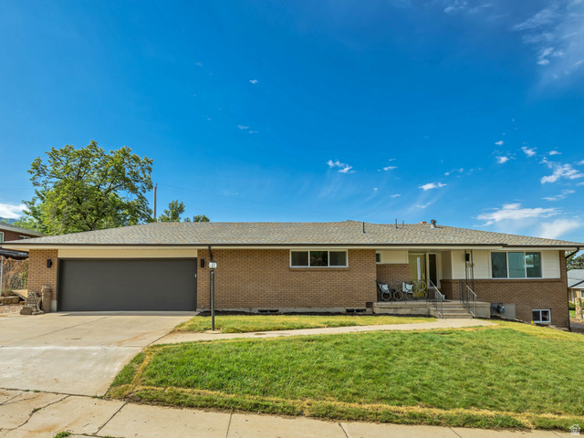 1168 East Center Street Bountiful, UT 84010 - Photo 1 of 38 Brick exterior with a gray asphalt shingle roof