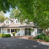 a view of a brick house with a large windows and large windows