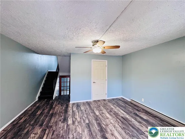 a view of a livingroom with wooden floor