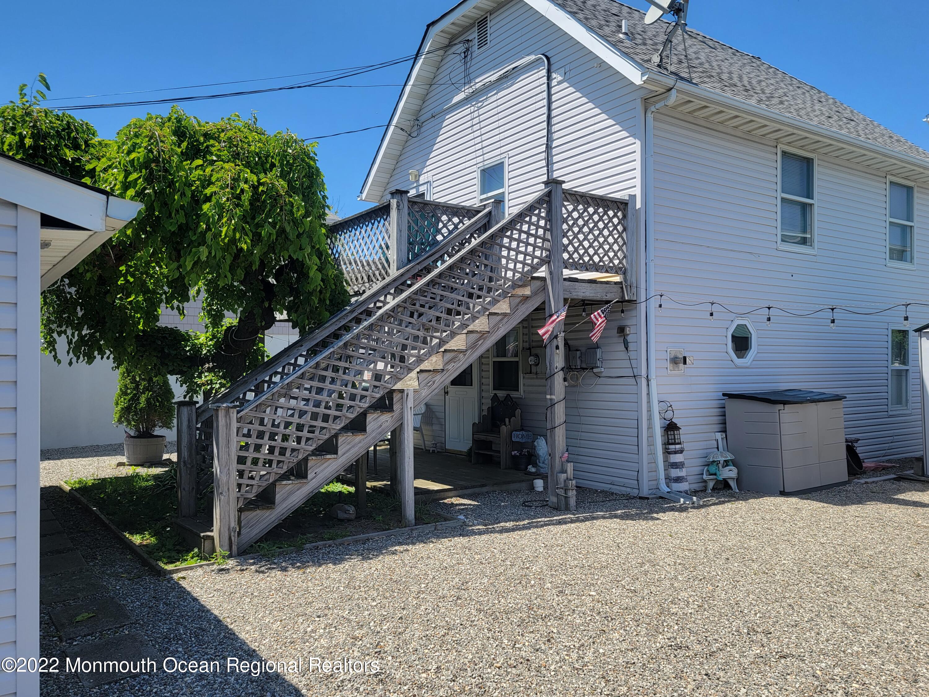 110 5th Avenue Seaside Park, NJ 08752 - Photo 3 of 25 a house with lots of trees in front of it