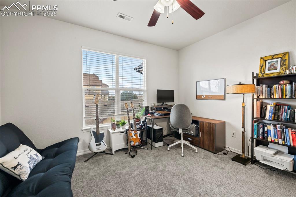 5378 Palomino Ranch Point, Unit 201 Colorado Springs, CO 80922 - Photo 9 of 15 a view of a livingroom with workspace and a window