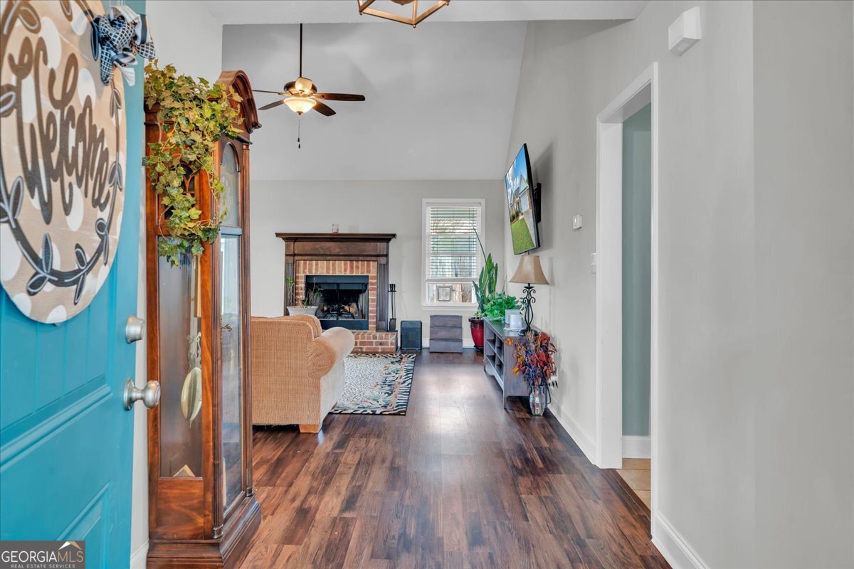 128 Gage Drive Perry, GA 31069 - Photo 2 of 38 a living room with furniture and a fireplace