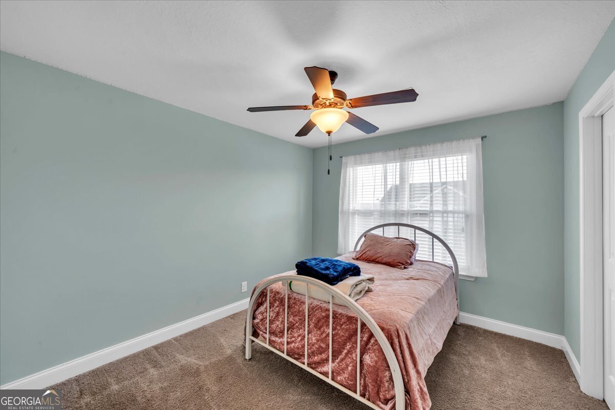 128 Gage Drive Perry, GA 31069 - Photo 21 of 38 a bedroom with a bed and window