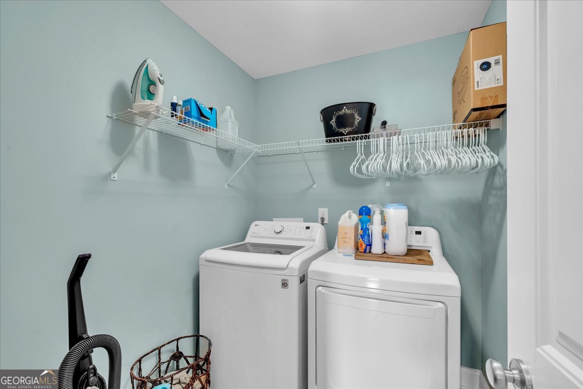 128 Gage Drive Perry, GA 31069 - Photo 26 of 38 a close view of utility room with washer and dryer
