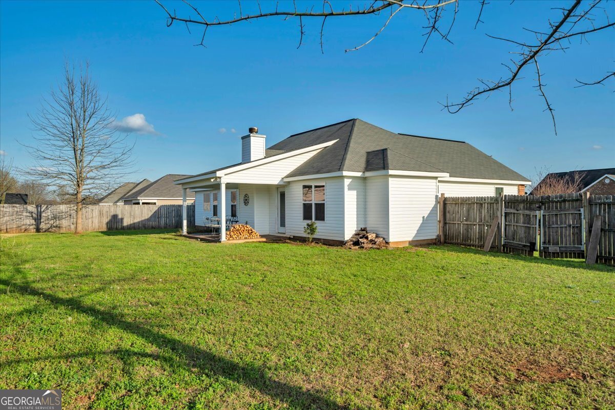 128 Gage Drive Perry, GA 31069 - Photo 28 of 38 a view of a house with a yard