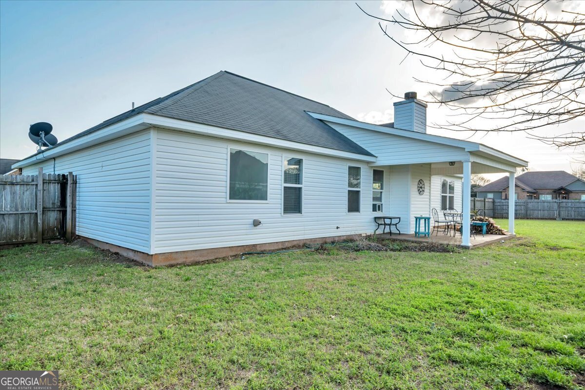128 Gage Drive Perry, GA 31069 - Photo 29 of 38 a view of a house with a yard and sitting area