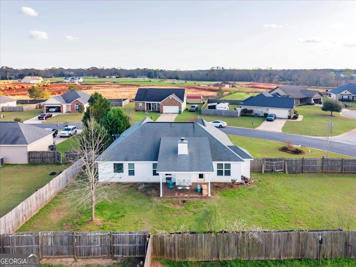 128 Gage Drive Perry, GA 31069 - Photo 31 of 38 an aerial view of residential houses with outdoor space and swimming pool