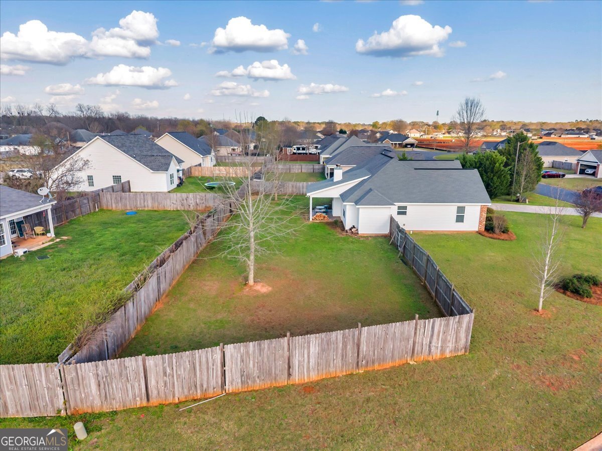 128 Gage Drive Perry, GA 31069 - Photo 36 of 38 an aerial view of residential houses with outdoor space and swimming pool