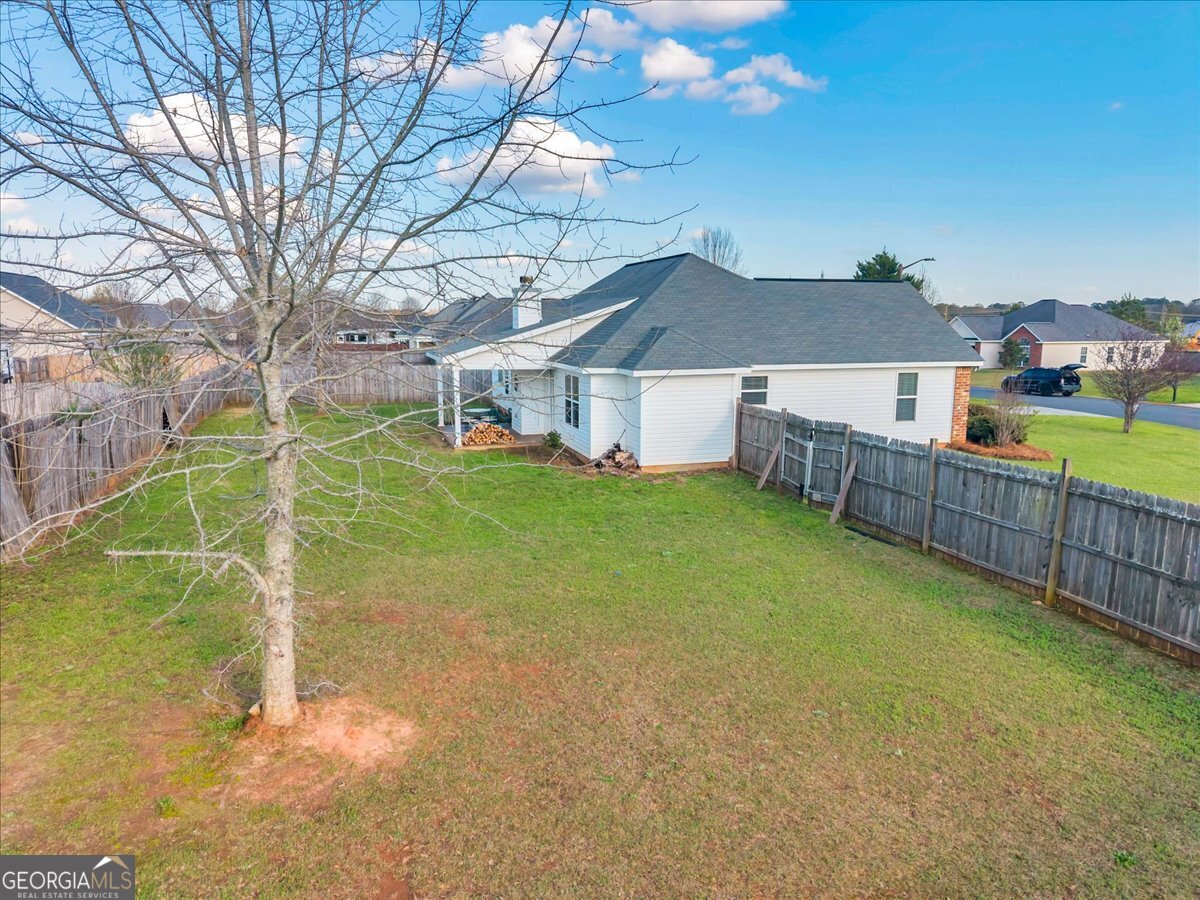 128 Gage Drive Perry, GA 31069 - Photo 37 of 38 a view of a house with a yard and wooden fence