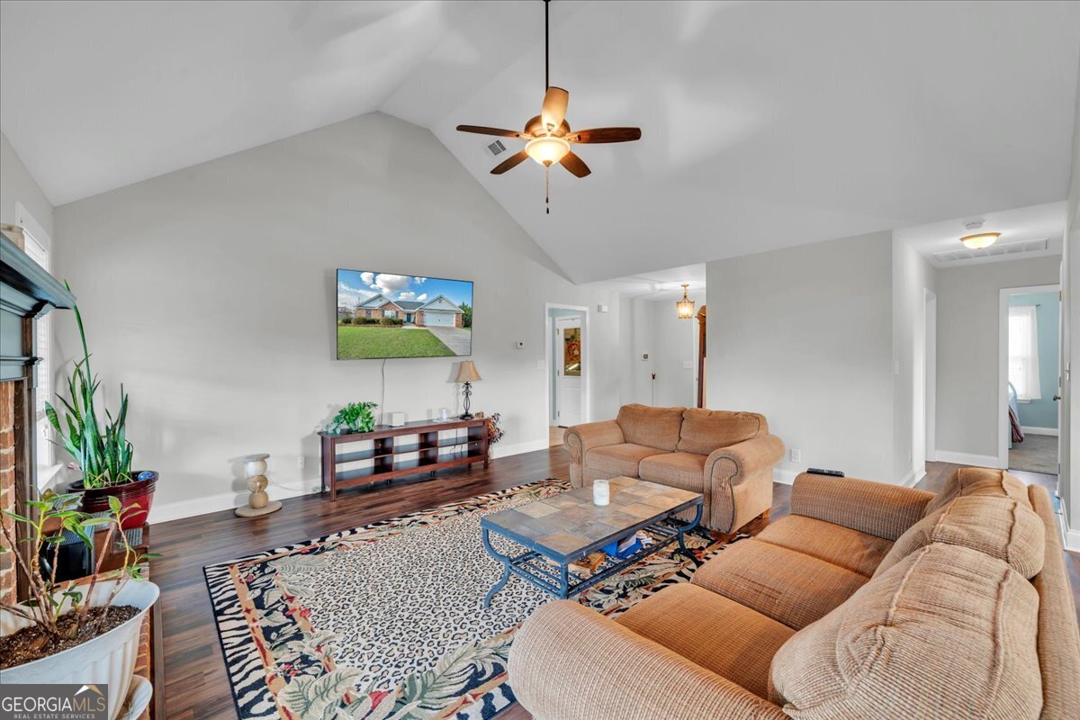 128 Gage Drive Perry, GA 31069 - Photo 5 of 38 a living room with furniture and a chandelier