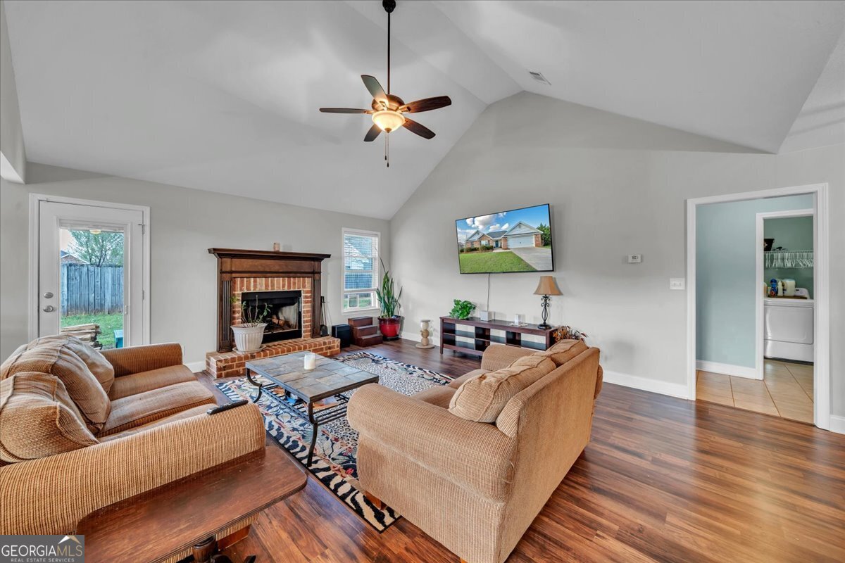 128 Gage Drive Perry, GA 31069 - Photo 6 of 38 a living room with furniture and a fireplace