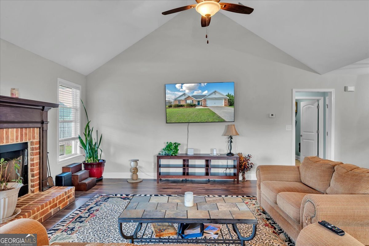 128 Gage Drive Perry, GA 31069 - Photo 10 of 38 a living room with furniture and a fireplace