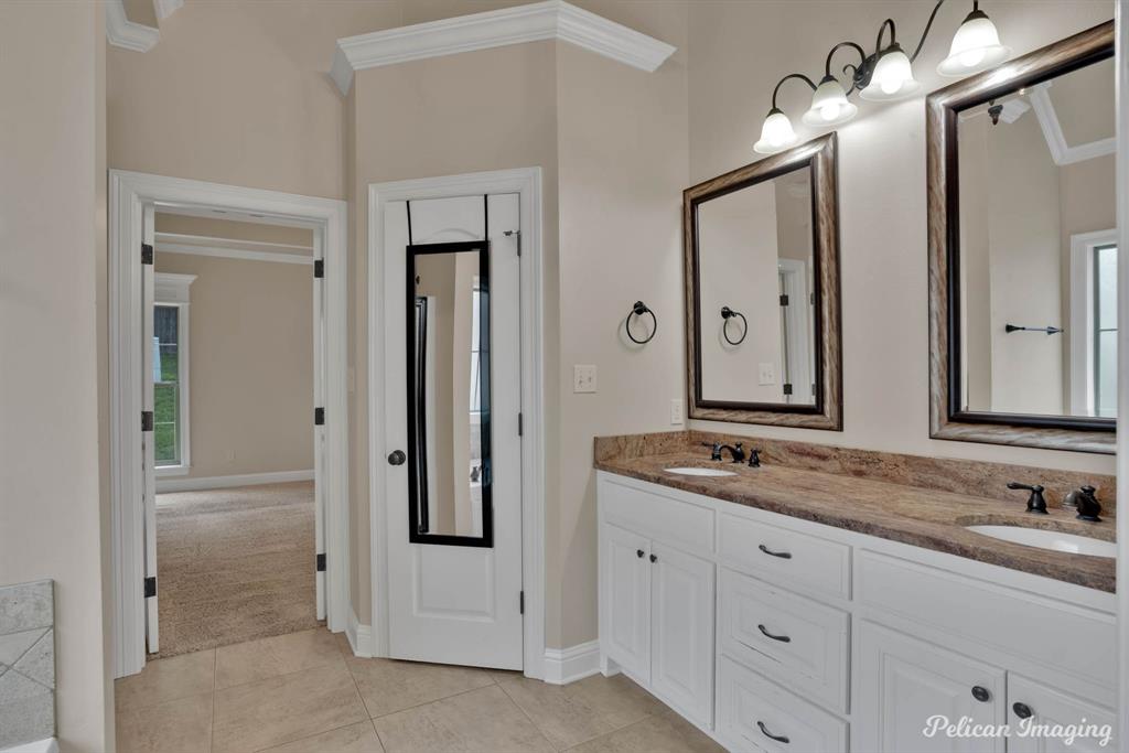 346 Wood Springs Haughton, LA 71037 - Photo 15 of 25 Full bath with double vanity, crown molding, and tile patterned floors