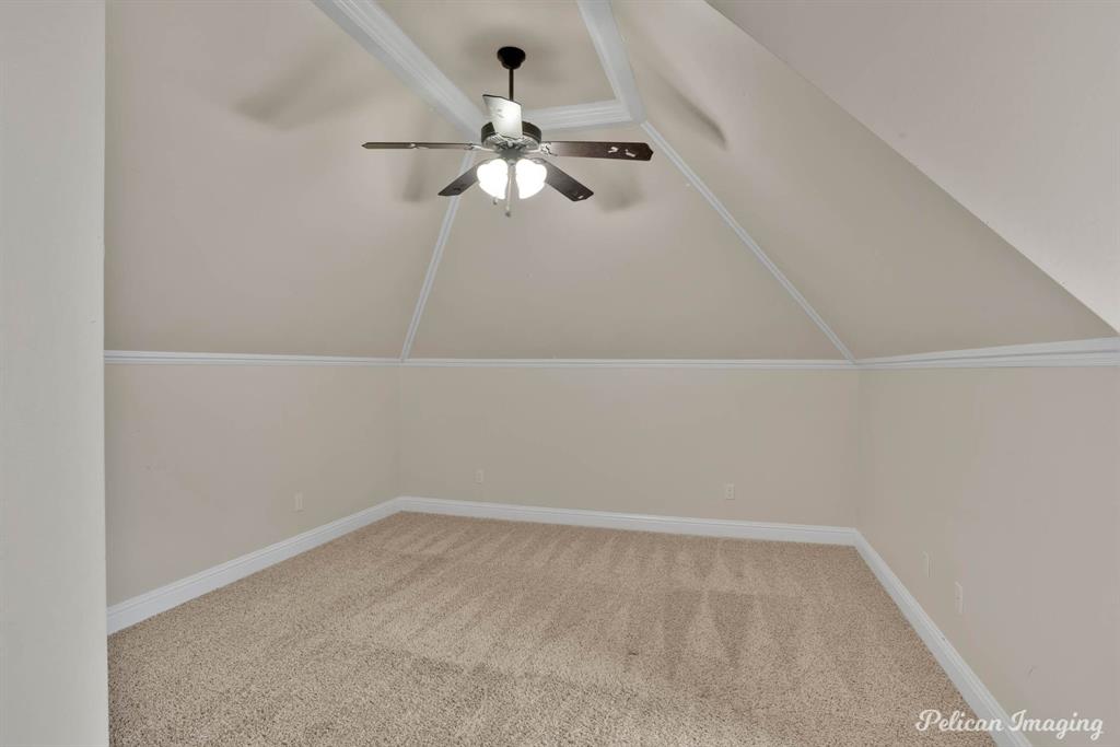 346 Wood Springs Haughton, LA 71037 - Photo 23 of 25 Additional living space featuring ceiling fan, carpet floors, and vaulted ceiling