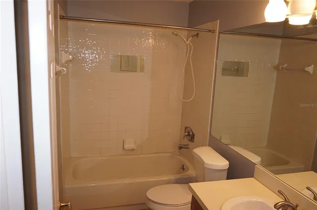 a bathroom with a shower and a toilet
