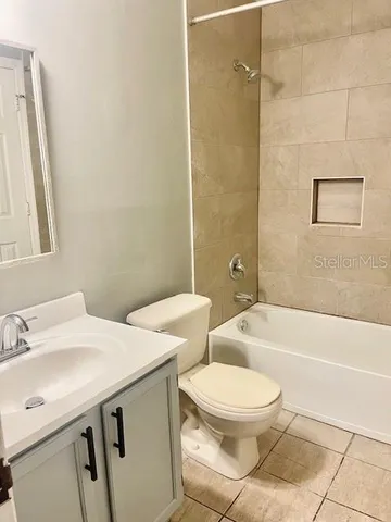 a bathroom with a sink a toilet and a bathtub