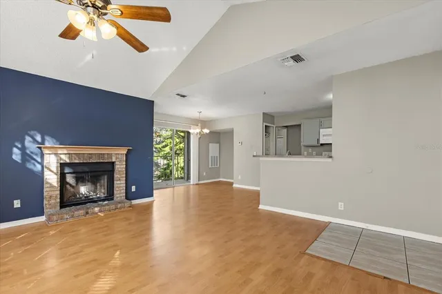 a view of a kitchen with a sink and a refrigerator