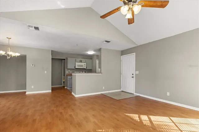 a view of a kitchen with furniture and chandelier